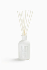 Antica Farmacista diffuseur d'ambiance avec palmes balayées par le vent, senteur florale durable.