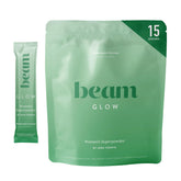 Beam Glow : bouteille poudre montrant le packaging et le produit, équilibre hormonal potentiel et bien-être quotidien.
