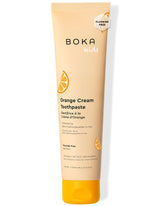 Pâte dentifrice Boka Orange Crème dans emballage, idéale pour la routine quotidienne des enfants.