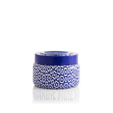 Capri Blue Coconut Santal dans sa boîte voyage, parfait pour emporter l’arôme tropical.