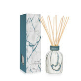 Capri Blue diffuseur à roseaux Volcano sur support marbre moderne pour une ambiance raffinée.