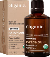 Huile essentielle Patchouli Cliganic dans sa bouteille, parfum terreux durable pour diffusion.