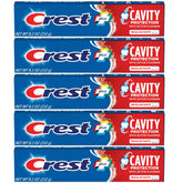 Crest dentifrice fluorure, tubes visibles, idéal pour la routine familiale et la prévention des caries.