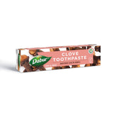 Dabur dentifrice aux herbes girofle, tube visible pour haleine fraîche naturelle.