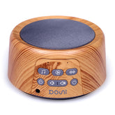 Douni machine bruit blanc avec finition bois, ambiance apaisante dans la chambre.
