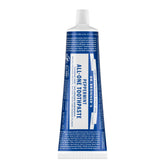Dentifrice Dr. Bronner’s All-One Menthe dans sa bouteille, haleine fraîche au quotidien.