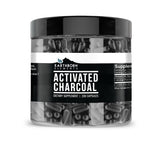 Earthborn Elements charbon actif en capsules dans une bouteille, pratique pour la routine quotidienne.