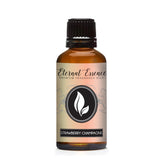 Huile parfumée Eternal Essence Oils Fraise-Champagne, flacon ambré pour bougies.