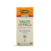 Flora Udo's Choice Omega 3-6-9, bouteille en verre sombre prête pour votre routine alimentaire.