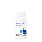 GNC Selenium 200mcg – bouteille et comprimés visibles, étiquette informative.
