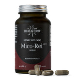 Gélules rouges Mico-Rei dans un flacon en verre, potentiel soutien immunitaire.
