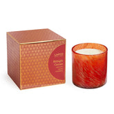 Bougie LAFCO Midnight Currant dans un verre soufflé allumée, ambiance festive