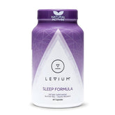Levium Sommeil: bouteille sur table de nuit prête pour une routine nocturne apaisante.