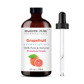 Majestic Pure huile de pamplemousse en flacon ambré avec compte-gouttes pour dosage précis.