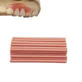 Matériau gencives-dentier-factice: bouteille d'application pratique pour prothèses temporaires.