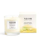 Bougie NEOM Citron-Basilic, etiquette parfumée pour énergie rafraîchissante dans une pièce