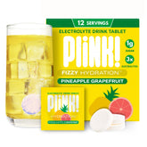Plink tablettes électrolyte goût ananas-pamplemousse dans un verre d'eau, hydratation fruitée.