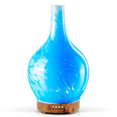 Porseme diffuseur: verre bleu vague, diffusion longue et ambiance paisible dans la chambre.