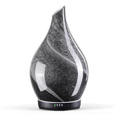 Porseme diffuseur en verre obsidien avec couvercle étoilé, ambiance relaxante.