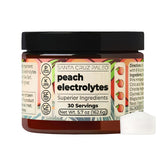 Santa Cruz Paleo Electrolyte Powder arôme pêche dans un verre d'eau pour une hydratation rafraîchissante.