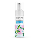 The Honey Pot Company lavage féminin en mousse bergamote et rose, offre une sensation douce et fraîche.