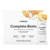THORNE Complete Biotic, pochette monodose orange, pratique pour voyager.