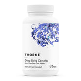 THORNE Complexe Sommeil Profond – bouteille ouverte et gélules prêtes pour un sommeil réparateur.