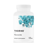 THORNE Niacinamide 500 mg — bouteille et capsules, soutien potentiel peau et sommeil.