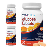 TRUEplus tablettes glucose orange dans la bouteille, pratique pour l'énergie rapide.