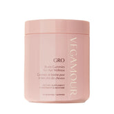 VEGAMOUR GRO Biotin Gummies, bouteille ouverte, texture gourmande pour routine capillaire.