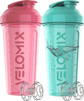 VELOMIX – bouteille protéine rose avec fouet-fil, mélange rapide pendant l'entraînement.