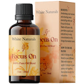 White Naturals Focus On: bouteille ambre illustrant le mélange pour concentration et clarté au travail.