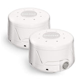 Yogasleep Dohm Classic: deux appareils blancs sur table de nuit pour favoriser le sommeil.