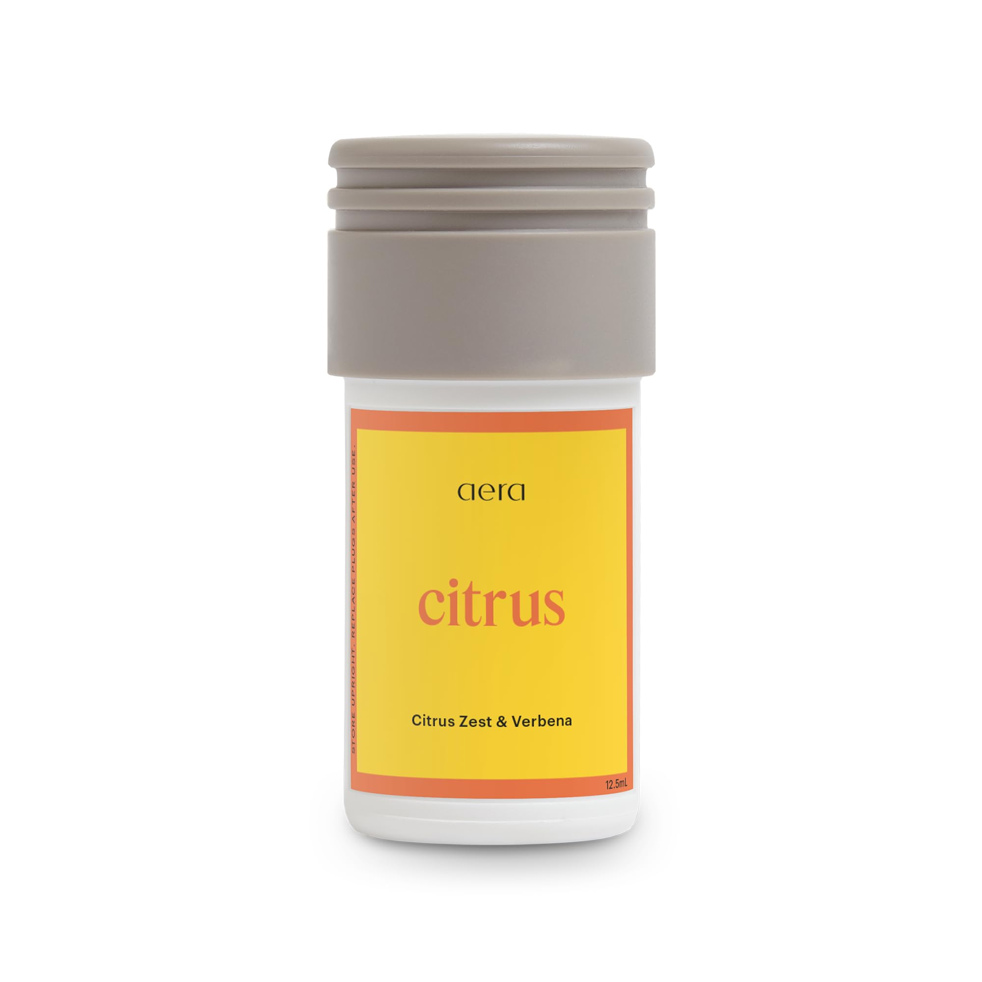 Aera Mini Citrus: bouteille citron-zeste pour une fragrance lumineuse et rafraîchissante.