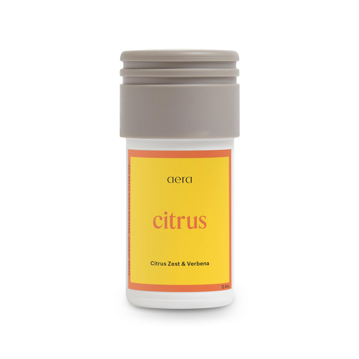 Aera Mini Citrus: bouteille citron-zeste pour une fragrance lumineuse et rafraîchissante.
