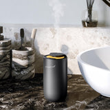 Diffusion compacte Air-Scent adaptée au bureau et au voyage.