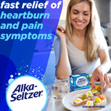 Comprimés effervescents Alka-Seltzer se dissolvant rapidement dans l'eau