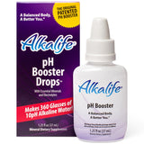 Gouttes Alkalife pH dans un verre, eau alcalinisée et hydratante.