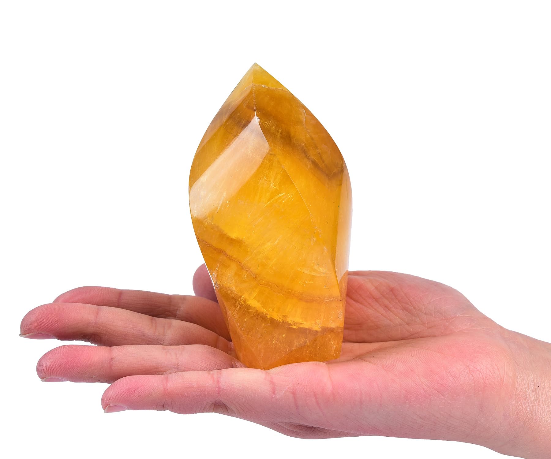AMOYSTONE fluorite orange pointe spirale décore élégamment un espace de travail.