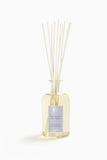 Diffuseur d'ambiance Antica Farmacista avec une bouteille lavande-lime, parfum durable pour le salon.