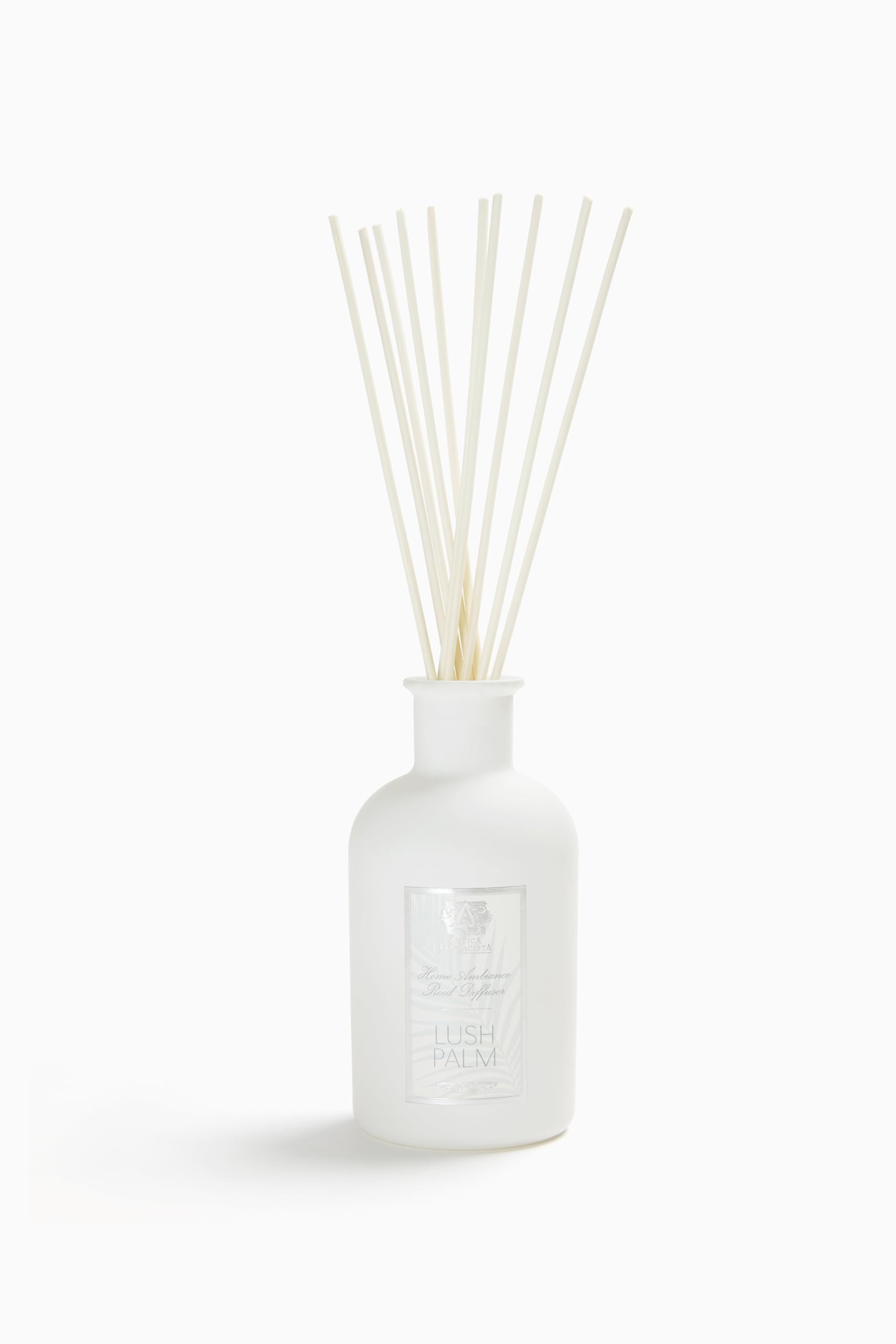 Antica Farmacista diffuseur d'ambiance avec palmes balayées par le vent, senteur florale durable.