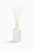 Antica Farmacista diffuseur d'ambiance avec palmes balayées par le vent, senteur florale durable.