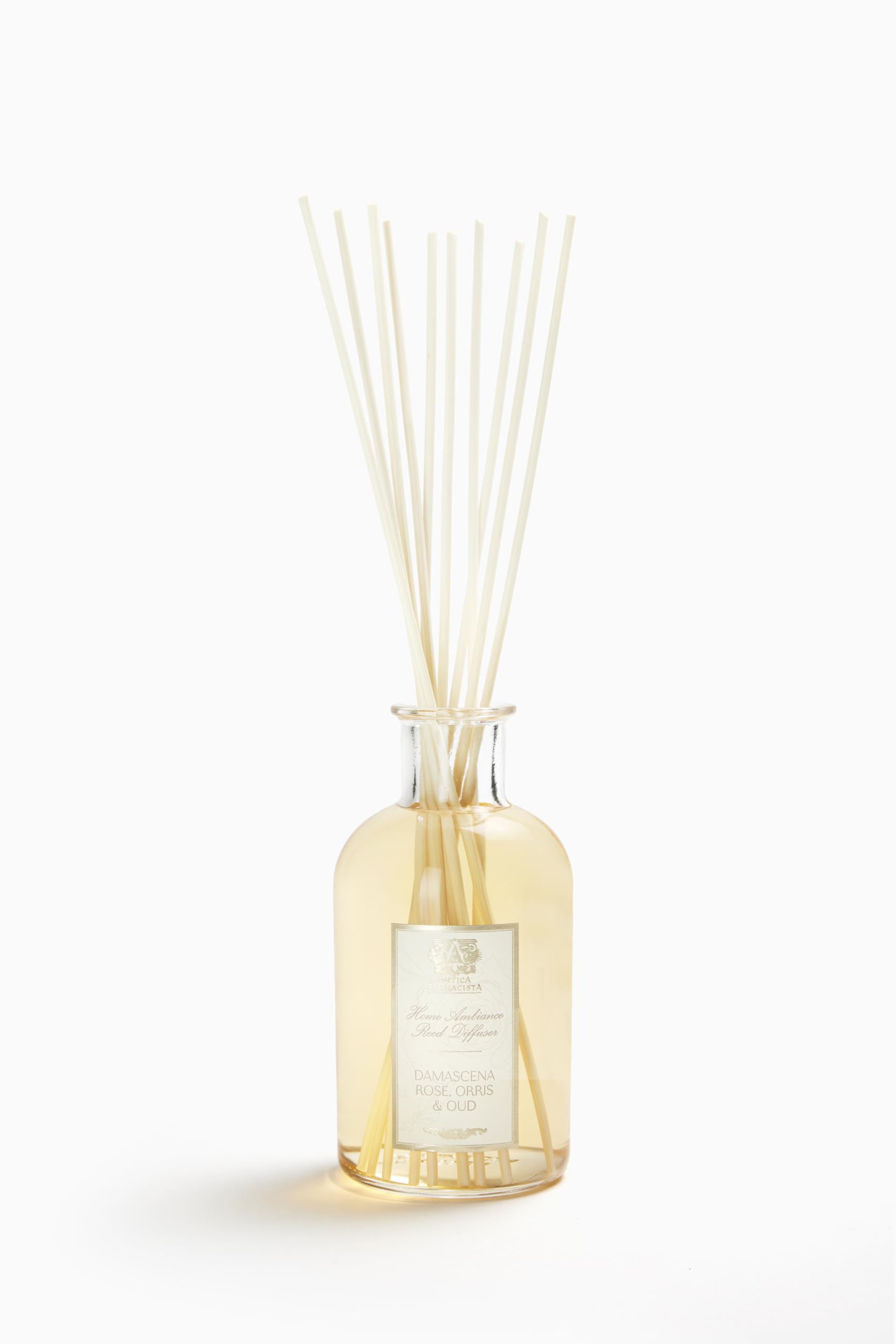 Diffuseur Antica Farmacista avec bouteille et tiges, parfum durable pour salon.