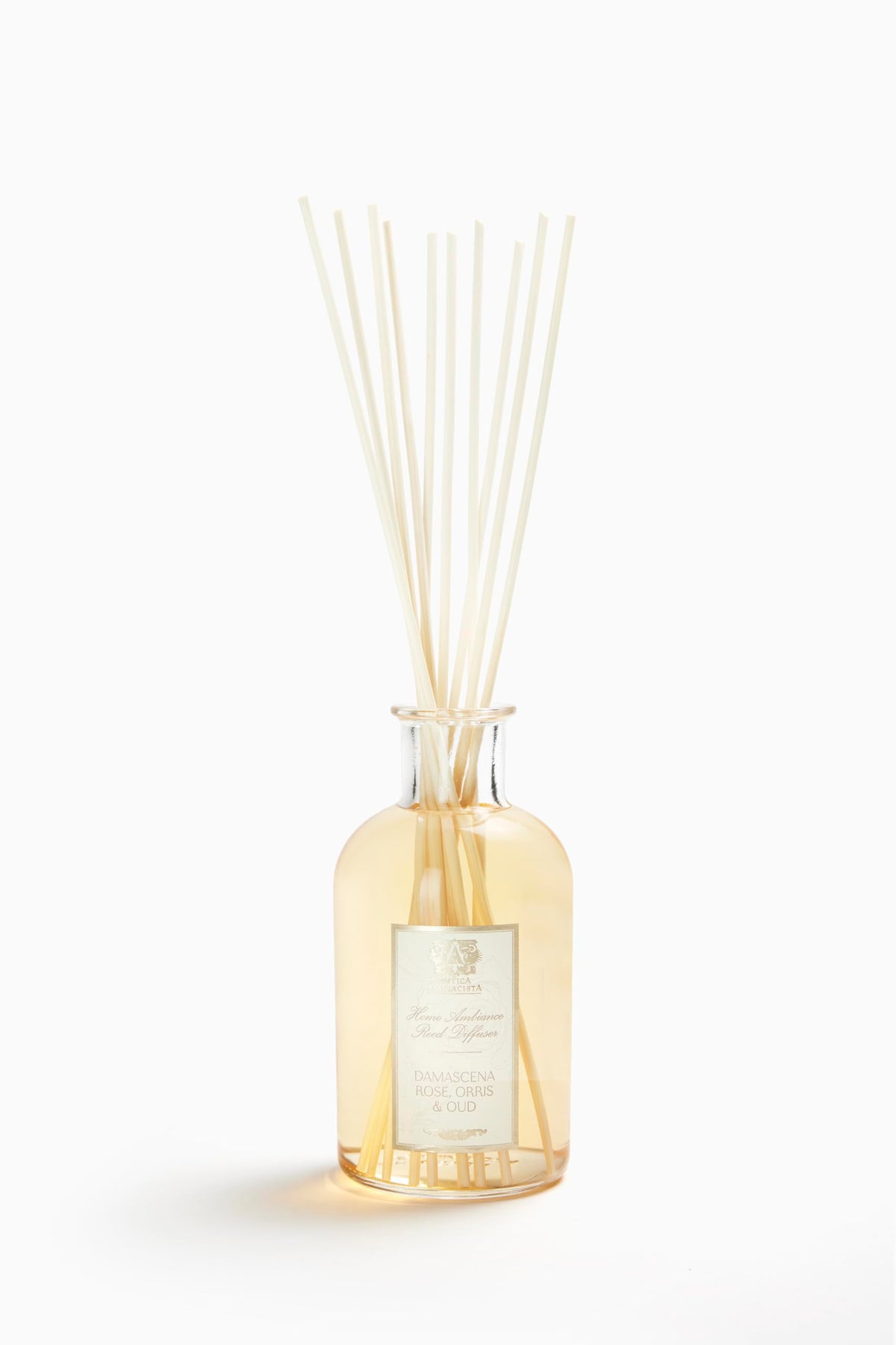 Diffuseur Antica Farmacista avec bouteille et tiges, parfum durable pour salon.