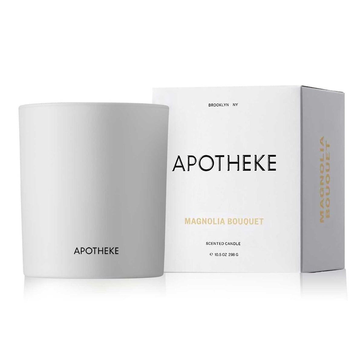APOTHEKE Signature Magnolia Bougie 11oz, ambiance florale chaleureuse idéale pour le salon.