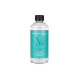 Huile de diffusion Aroma360 Miami Beach dans sa bouteille, parfum luxueux pour une ambiance sophistiquée.