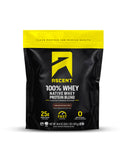 Ascent Whey Protéine en poudre dans emballage avec cuillère, pratique pour démarrer après l'entraînement.