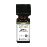Aura Cacia Copaïba: huile pure utilisée en diffusion pour purifier l'air et créer une ambiance apaisante.