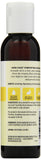 Aura Cacia huile avocat – goutte appliquée sur peau pour massage.