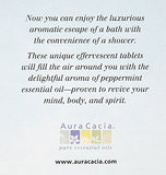 Tablettes douche menthe poivrée Aura Cacia en action sur le plancher de la douche